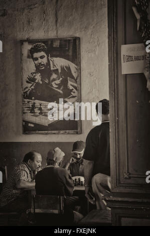 Men playing chess at the Chess club at Santiago de Cuba, Cuba. Stock Photo