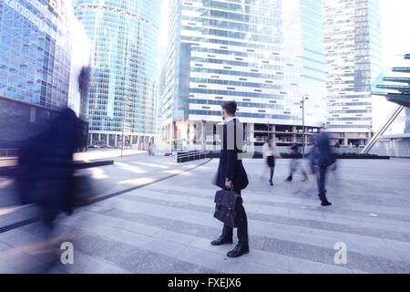 Handsome businessman talking on the cellphone outside office building Stock Photo