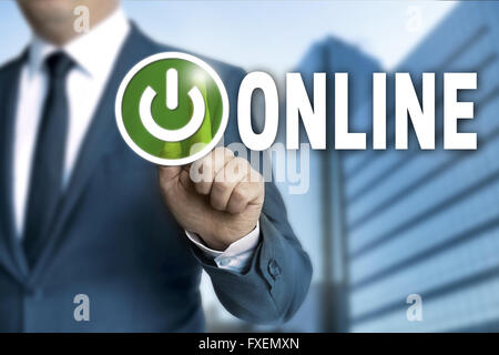 online touchscreen is operated by businessman. Stock Photo