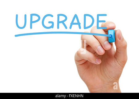 Hand writing Upgrade with blue marker on transparent wipe board. Stock Photo