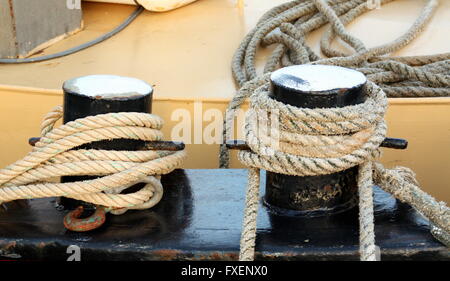 Rope around two poles to capture a fishing boat Stock Photo