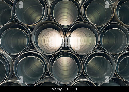 Metallic Pipes stacked in rows pattern Stock Photo