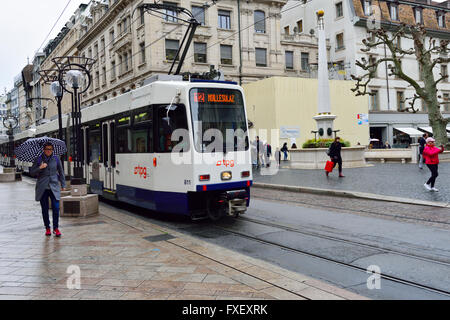 Electric tram or trolley-bus in the rain, Geneva, Switzerland Stock Photo