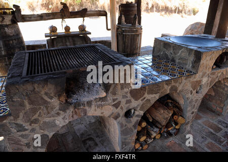 Outdoor kitchen with fireplace and grill for producing flavoured tequilas alcoholic beverage in Jalisco Mexico Stock Photo