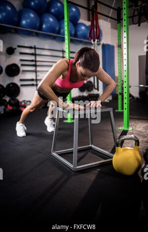 Woman doing push ups Stock Photo