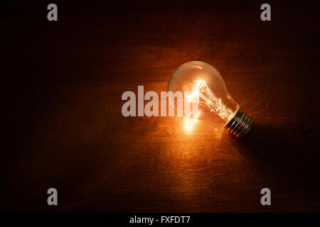 light bulb on dark background, concept of creativity. Stock Photo