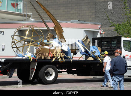 North Hollywood, California, USA. 15th Apr, 2016. The world's largest Emmy statuette as she makes her hour-long journey along California Highway 101 from East Los Angeles to her new home at the Television Academy's North Hollywood campus. Nearly one year in the making, the 18-foot tall, 1750 pound golden Emmy replica depicts the winged muse of art holding an electron atom. Cast in pure silicon bronze, she was painstakingly created by 45 separate craftsmen. © Gene Blevins/ZUMA Wire/Alamy Live News Stock Photo