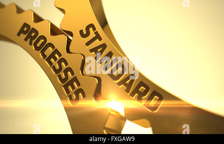 Standard Processes on Golden Metallic Cogwheels. Stock Photo