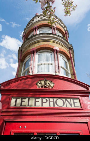 One of London's red telephone boxes, or kiosks, designed by Sir Giles Gilbert Scott, Stock Photo