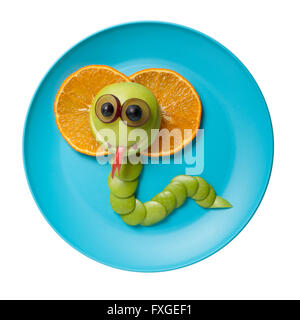 Cobra made of fruits on blue plate Stock Photo