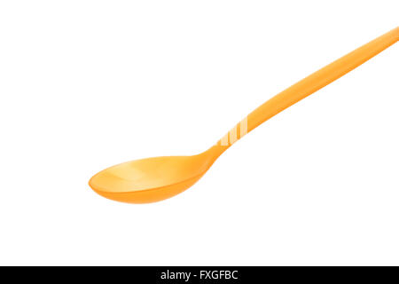 Orange plastic spoon on white background Stock Photo