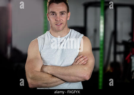 Man standing with arms crossed Stock Photo