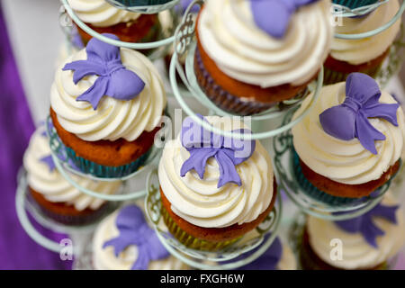 Vanilla cupcakes with mauve bow Stock Photo