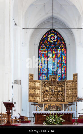 Chancel, altar and stained glass window in  St. Mary's Church (Basilica Mariacka)  in Gdansk, Poland Stock Photo