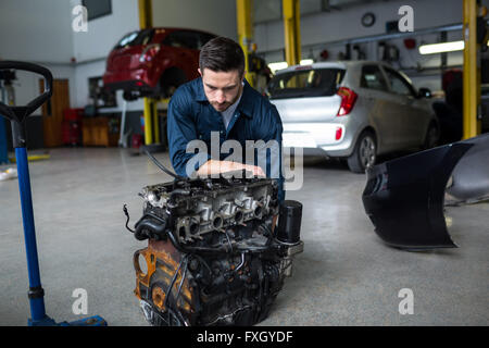 Mechanic working on an engine Stock Photo