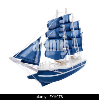 Isolated objects: blue sailboat with blue sails, generic scale model, on white background Stock Photo