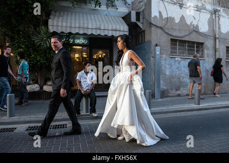 Wedding couple during their photo session at Shalom Shabazi street in Neve Tzedek neighborhood, Tel Aviv city, Israel Stock Photo