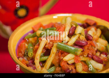 Herbed three-bean dish with tomatoes in a bowl
