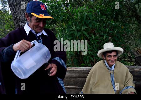 Farmers drinking Cañazo ( Sugar cane fermented ) in Pulun 