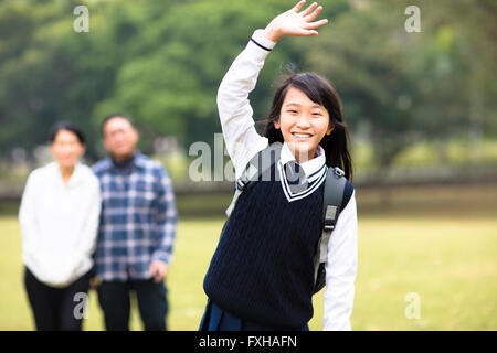 cute young student girl with parent in school Stock Photo