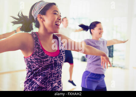 Enthusiastic women enjoying aerobics class Stock Photo