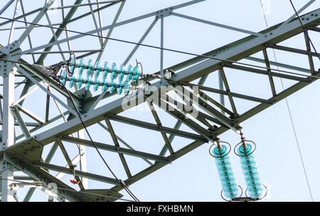 Traverse and insulators at a tension tower of a high-voltage line Stock Photo