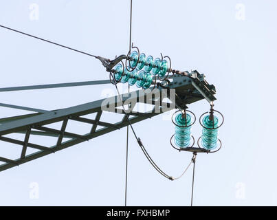 Traverse and insulators at a tension tower of a high-voltage line Stock Photo