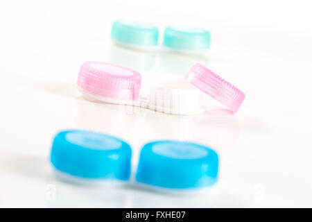 blue and pink plastic contacts case on the white background Stock Photo