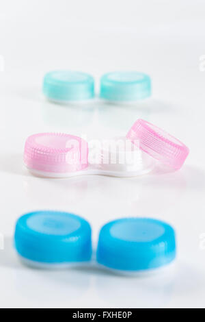 blue and pink plastic contacts case on the white background Stock Photo