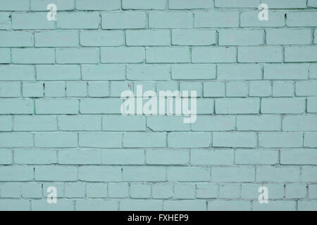 Blue teal painted pale old brick wall texture background Stock Photo