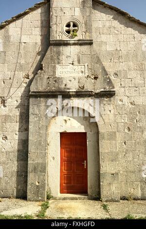 Old serbian-orthodox church of Veličani is dotted over and over with bulletholes. Stock Photo
