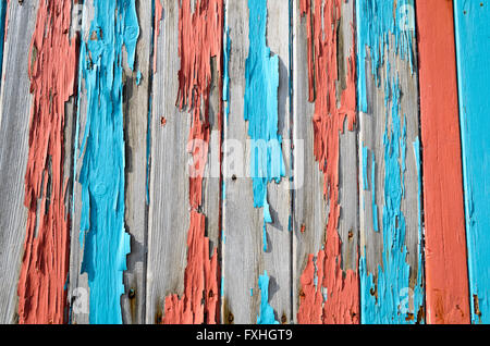 Closeup of old cracked paint texture on a wooden fence. Stock Photo