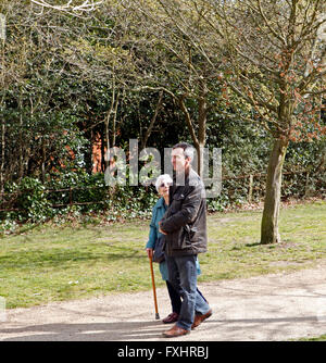Man out walking with his retired mother. Stock Photo