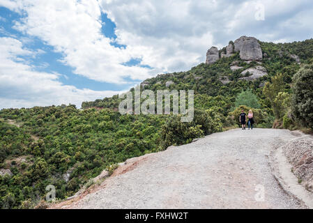 Tourist trial in Montserrat mountains near Benedictine abbey Santa Maria de Montserrat, Monistrol de Montserrat, Spain Stock Photo