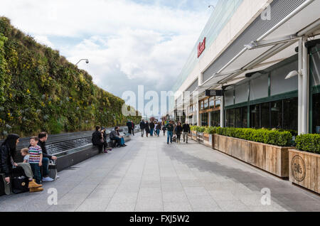Looking along a pedestrian walkway at Westfield Shopping Centre in Shepherds Bush London. Stock Photo