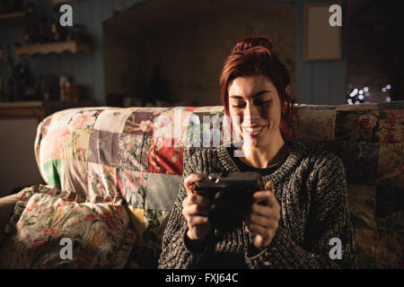 Young woman looking at her camera Stock Photo