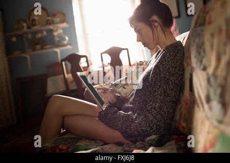 Young woman using digital tablet Stock Photo