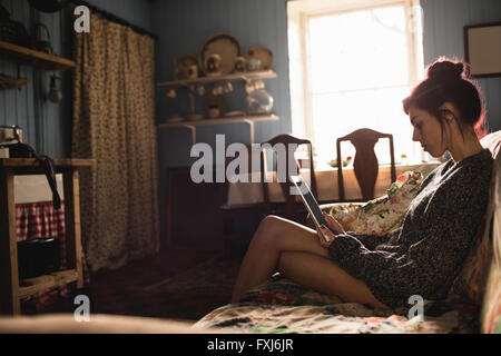 Young woman using digital tablet Stock Photo