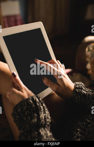 Woman using digital tablet Stock Photo