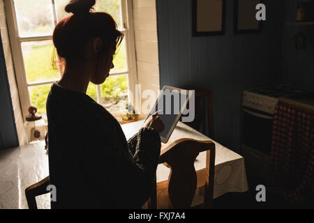 Young woman using digital tablet Stock Photo