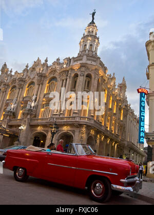 Vertical close up of a vintage American car parked infront of the Grand Theatre at sunset in Havana, Cuba. Stock Photo