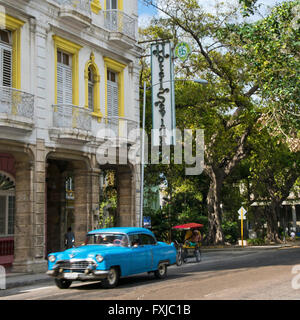 Square view of a vintage American car driving by Hotel Sevilla in Havana, Cuba. Stock Photo