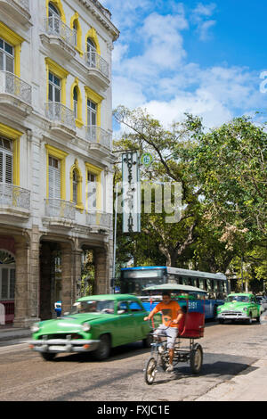 Vertical view of a vintage American car driving by Hotel Sevilla in Havana, Cuba. Stock Photo