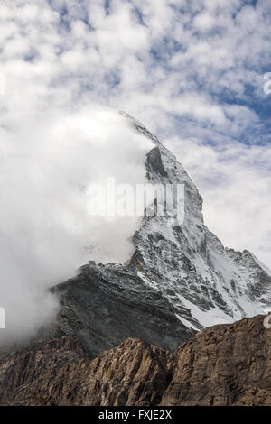 The Matterhorn half obscured by clouds along the Hornli ridge Stock Photo