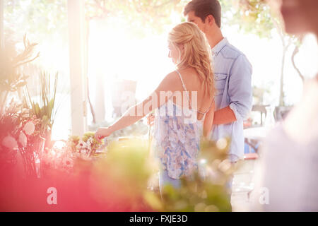 Customers shopping for flowers in flower shop Stock Photo