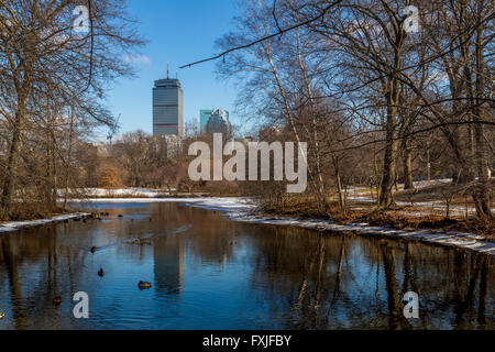 The Prudential Tower from across a lake in the Back Bay Fens part of the Emerald Necklace in winter ,Boston,Mass Stock Photo