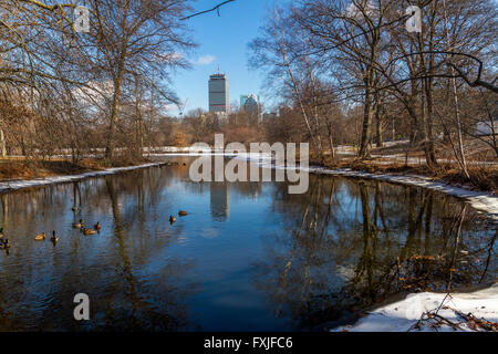 The Prudential Tower from across a lake in the Back Bay Fens part of the Emerald Necklace in winter ,Boston,Mass Stock Photo