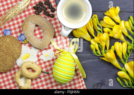 aster breakfast table decorated with yellow freesias Stock Photo