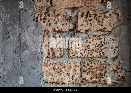 wall of limestone with cement background Stock Photo