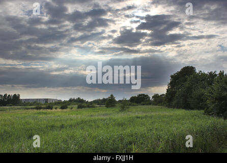 Sunbeams are breaking through the sky in Mecklenburg-Vorpommern, Germany. Stock Photo